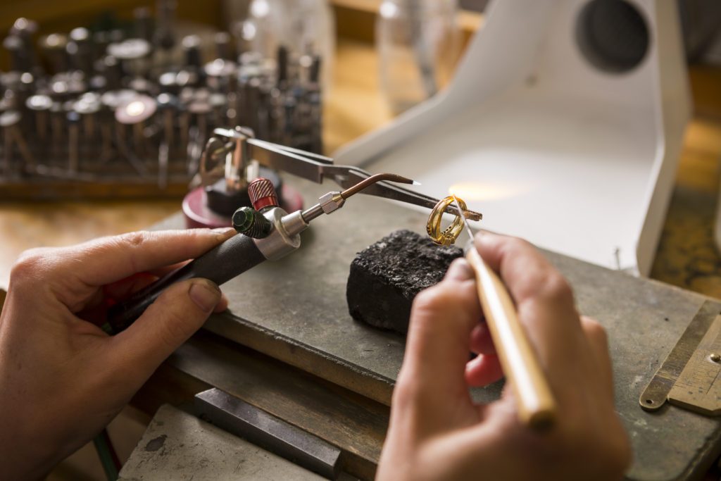 Goldsmith at work on a custom piece